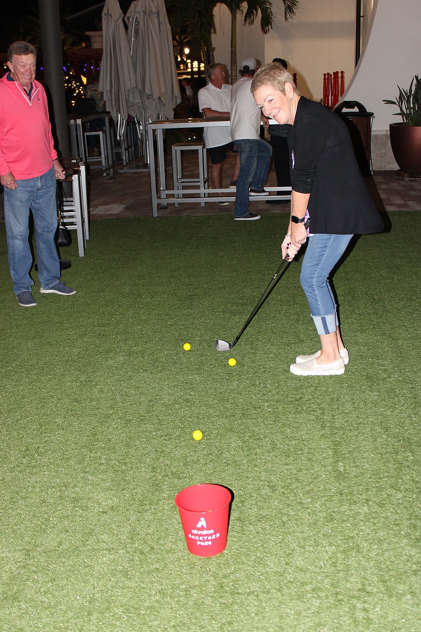 Lakewood Ranch's Carol McCabe tries her pitching skills in a game at Waterside Place during the World Champions Cup block party. She won two tickets to Sunday's match.
