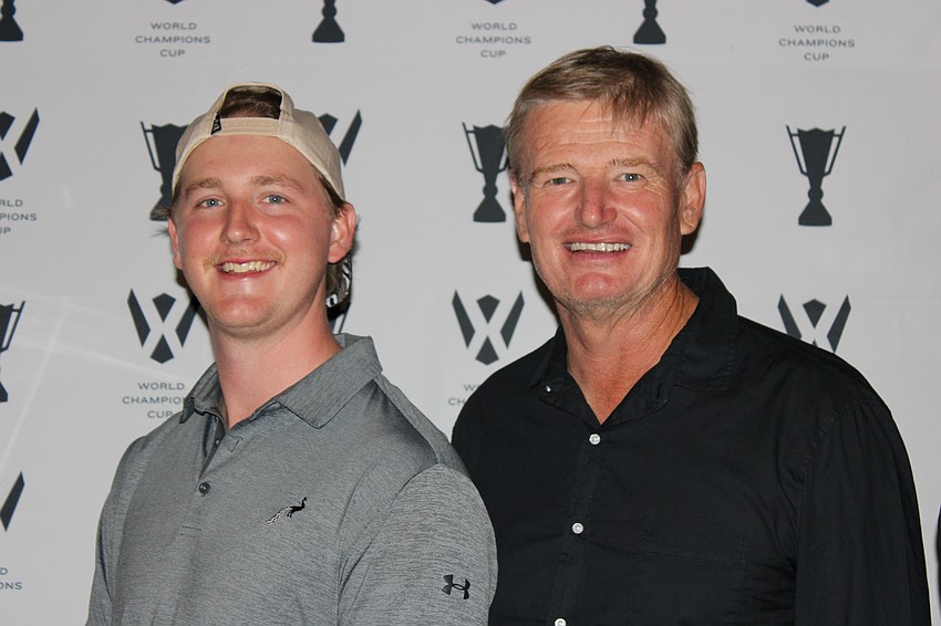 Sarasota's Rich Boyd gets a photo with World Golf Hall of Famer Ernie Els at the World Champions Cup block party at Waterside Place on Friday.