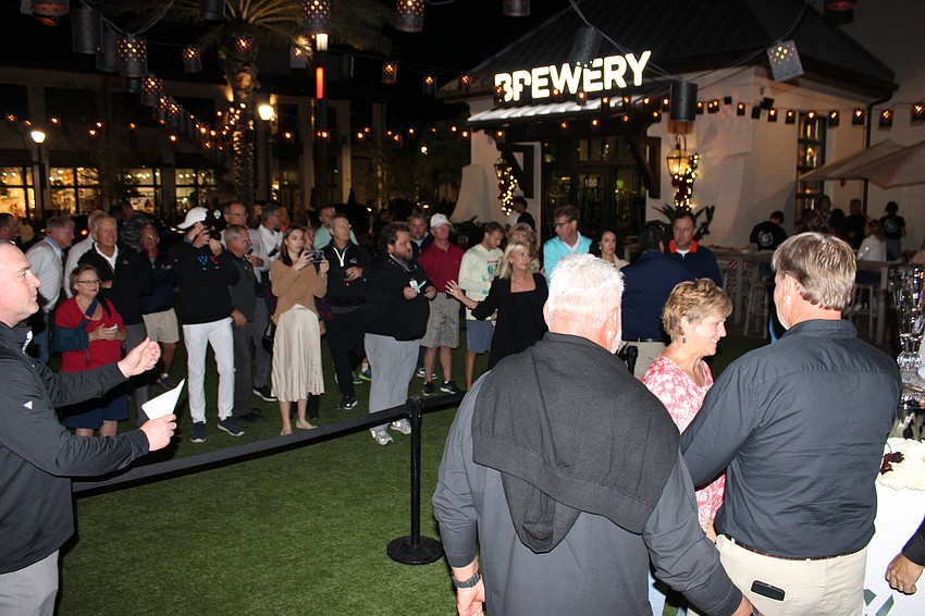 The crowd at Waterside Place lines up to take photos with the players.