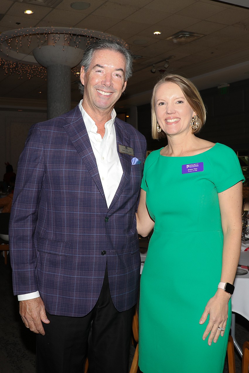 Event auctioneer Ray Collins with SPARCC President and CEO Jessica Hays