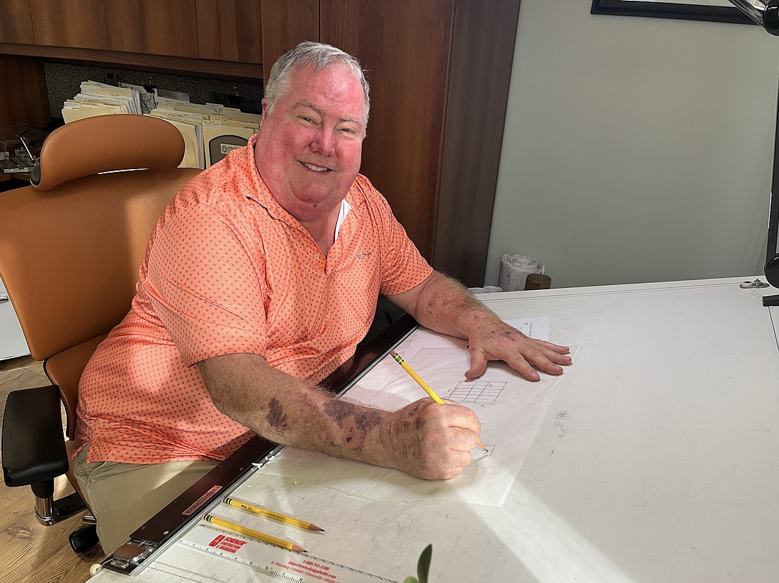 River Club's Douglas Whitney, an architect for 43 years, always has loved drawing by hand. He is the only one in WBRC's Lakewood Ranch office to still have a drafting table.