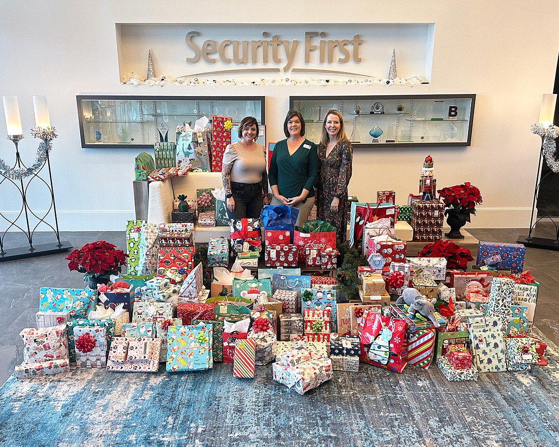 Jenny Kumar, Security First’s talent acquisition partner; Susan Moor, vice president of philanthropy at Easterseals North Central Florida; and Melissa Burt DeVriese, president of Security First Insurance. Courtesy photo