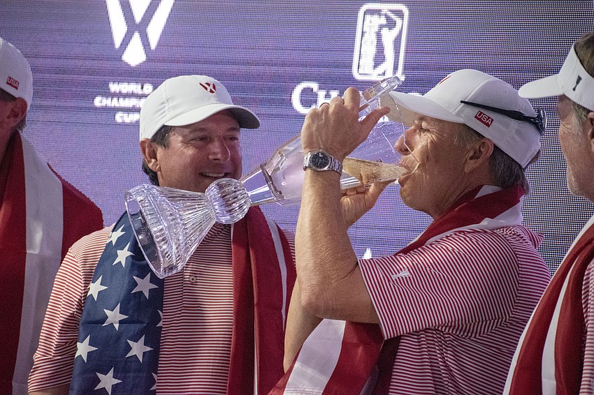 David Toms takes a drink of champagne from the World Champions Cup after Team USA's win at The Concession Golf Club.