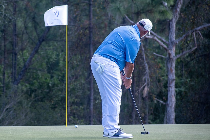 Team Europe's Darren Clarke putts on the No. 4 hole at The Concession Golf Club on the final day of the World Champions Cup. Clarke would bogey the hole to earn zero points.
