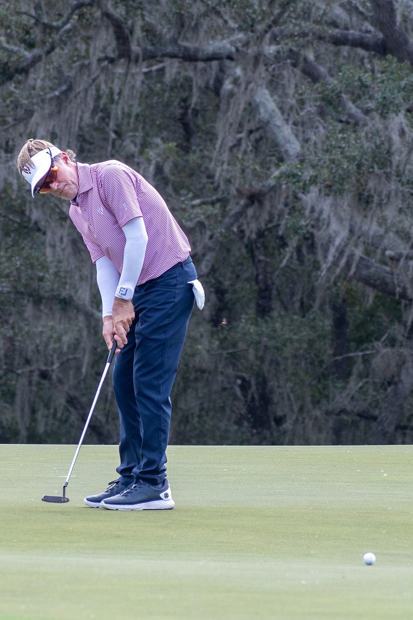 Team USA's Brett Quigley putts on the No. 5 hole at The Concession Golf Club on the final day of the World Champions Cup. Quigley would par the hole to earn one point.