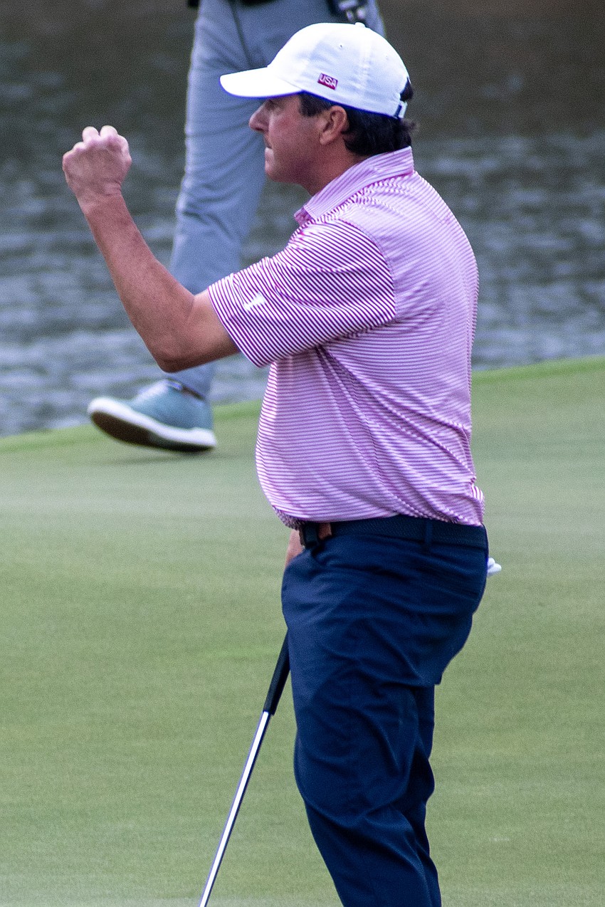 Billy Andrade pumps his first after sinking a putt on the No. 9 hole at The Concession Golf Club on the final day of the World Champions Cup. Andrade's putt was for par and helped Team USA earn 1.5 points.
