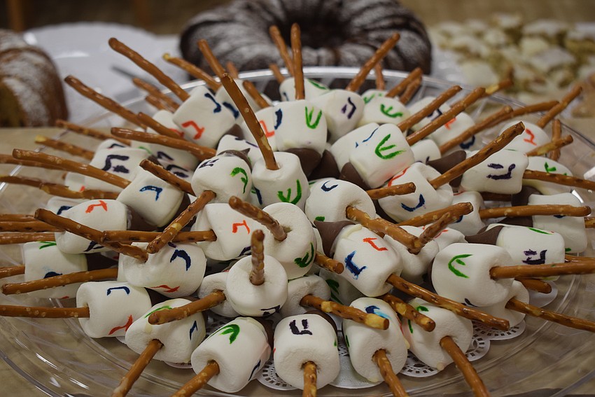 Temple Beth Israel celebrated Hanukkah together with a dinner party after services on Dec. 8.