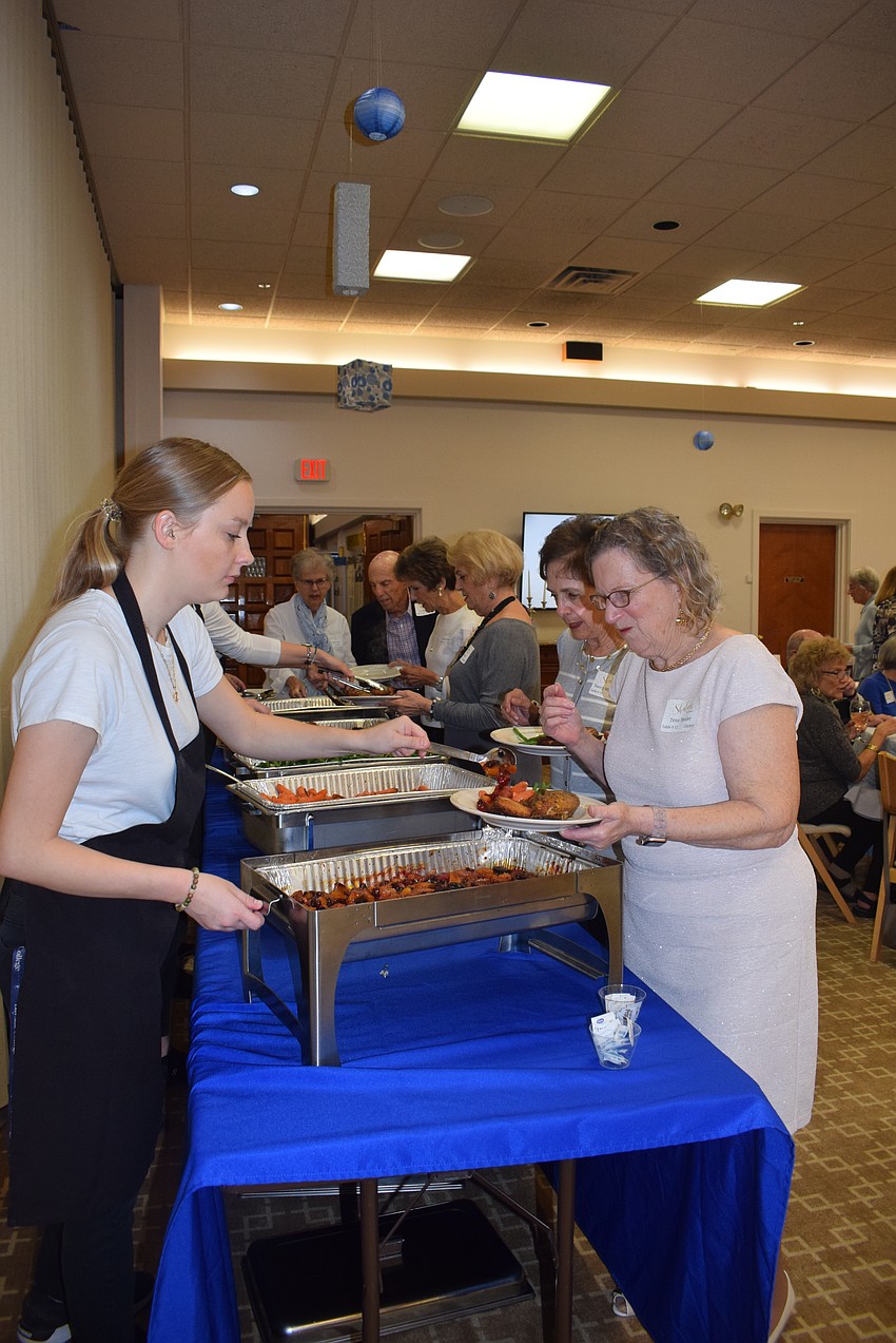 Temple Beth Israel celebrated Hanukkah together with a dinner party after services on Dec. 8.