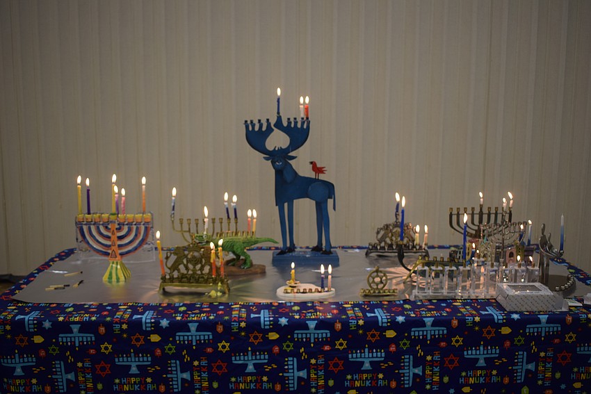 Temple Beth Israel celebrated Hanukkah together with a dinner party after services on Dec. 8.