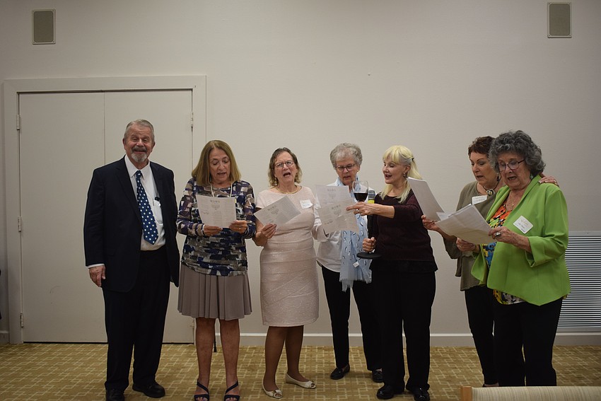 Rabbi Stephen Sniderman and Beth Israel Women sing traditional Jewish songs at their Hanukkah feast.