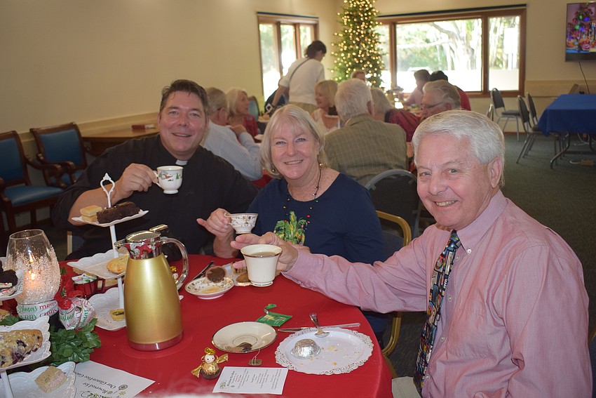 Reverend David Mashall with Carol and Bob Erker
