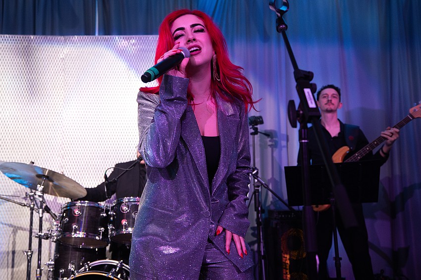 Emily Maddox of Madd Jazz Band performs for patrons.