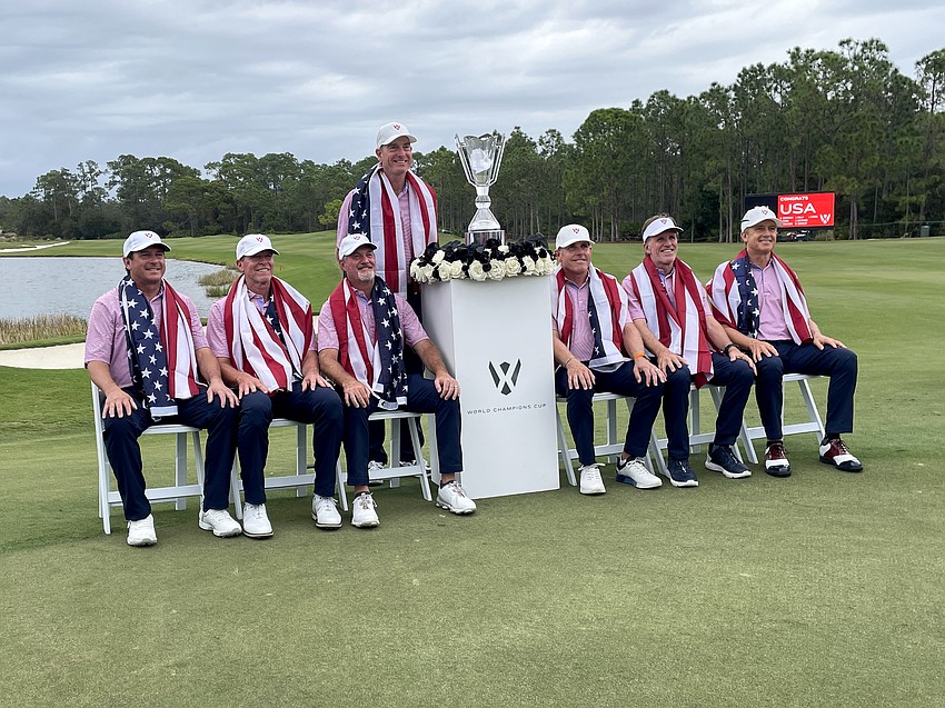 Billy Andrade, Steve Stricker, Jerry Kelly, Jim Furyk, Justin Leonard, Brett Quigley and David Toms pose with the World Champions Cup trophy.
