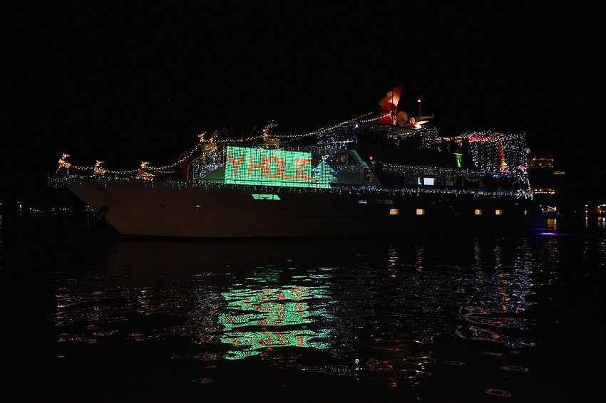 The Lotus yacht captained by Casey Hovey makes its way along the parade route.