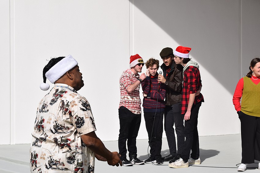 The Manatee School for the Arts Jazz Choir performed in the Karon Family Pavilion at Market on the Key.