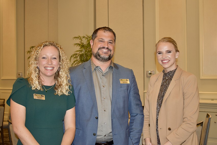 President Brittany Lamont, board member Keith Pandeloglou and Communications Coordinator Kristie Calandro prepare for the last meeting of the year.