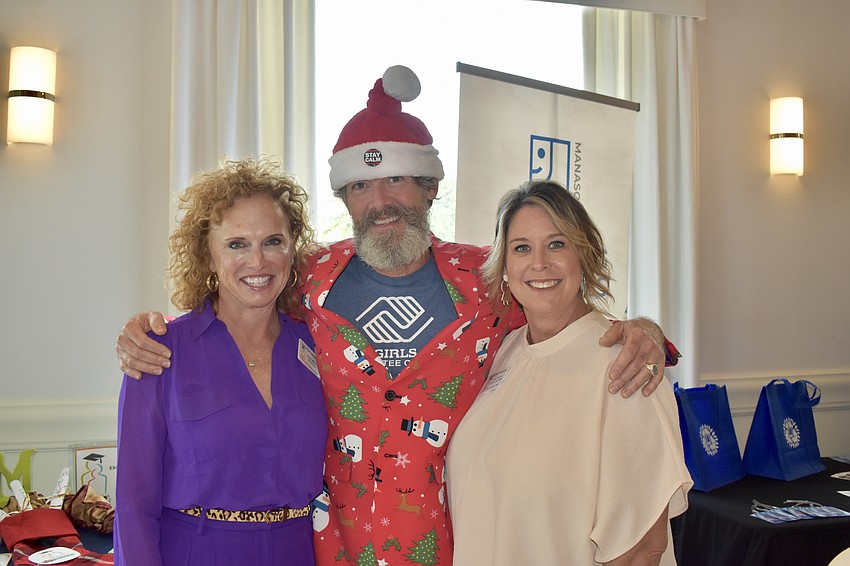 Take Stock Manatee CEO Anne LeBaron, Boys and Girls Club Volunteer Communications Manager Robert Rogers and Take Stock's Community Liason Ann Colonna have booths set up to promote their charities.