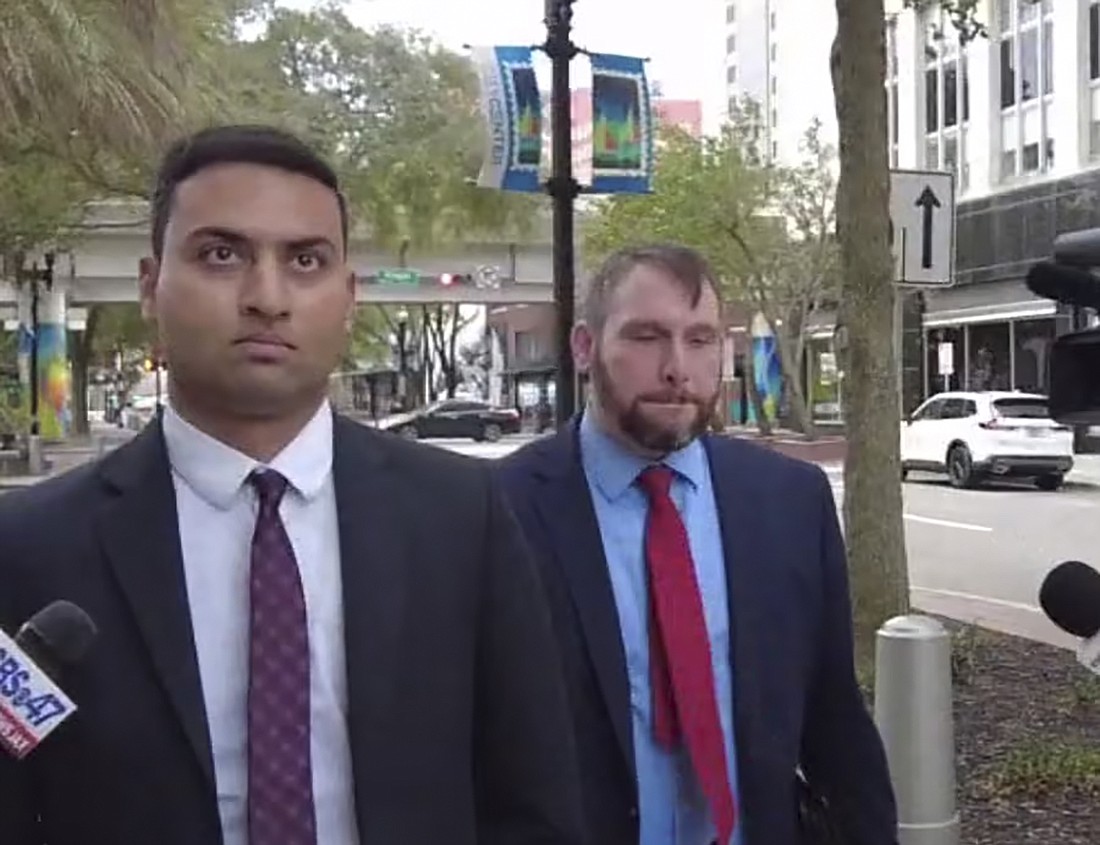 Former Jacksonville Jaguars financial manager Amit Patel, left, and his attorney, Alex King, leave the Bryan Simpson U.S. Courthouse in Downtown Jacksonvile on Dec. 14.