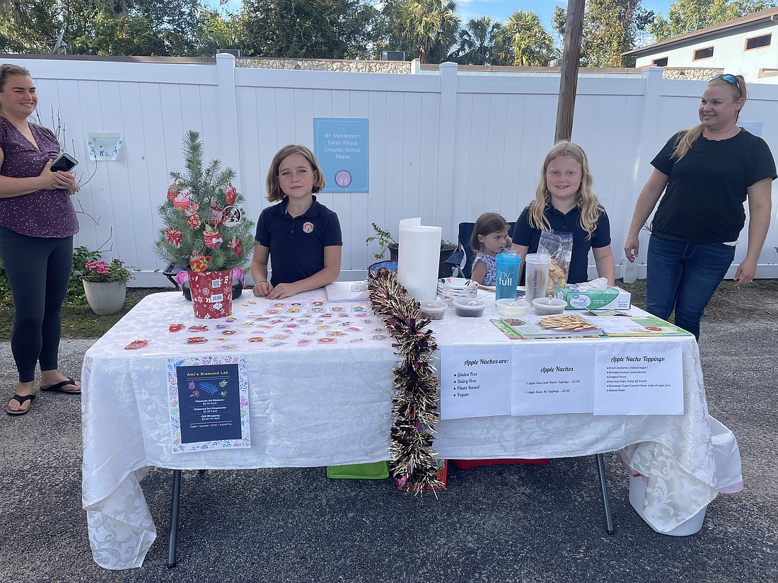Amalie Smith, 10, of Amalie’s Diamond Lab (stickers, artistic ornaments and gift wrapping); and Penelope Zaharios, of Penelope’s Apple Nachos Shop. Courtesy photo