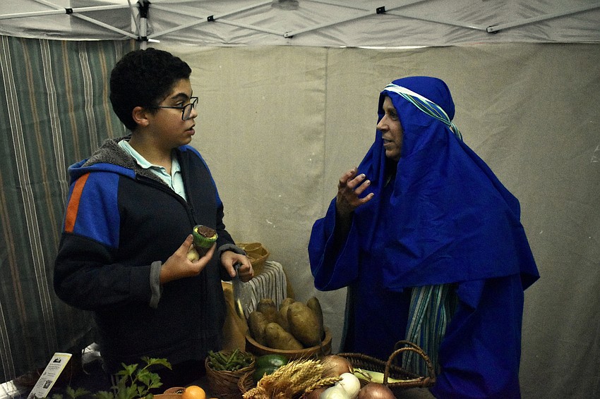 Kiro Gad talks with Karen Kloo about the food items in the market.