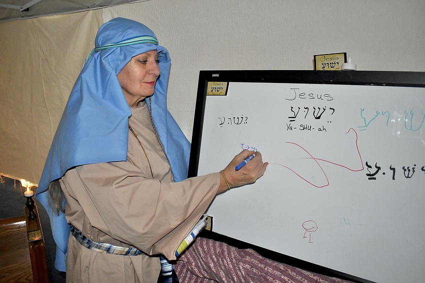 Sara Slater demonstrates Hebrew writing.