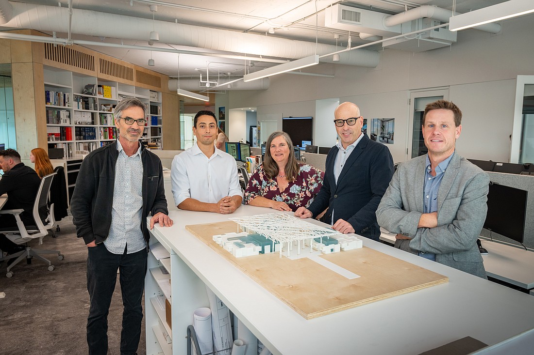 Jerry Sparkman, Karl Bernhard, Michele Demperio, Todd Sweet and John Bryant with Sarasota-based architecture firm Sweet Sparkman stand in front of the winning design for the Reimagining Pei competition.