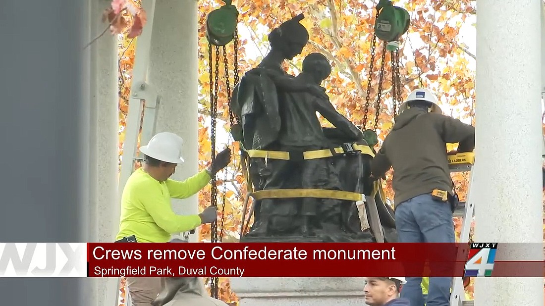 Crews prepare to remove the Tribute to the Women of the Confederacy monument in Springfield Park on Dec. 27.