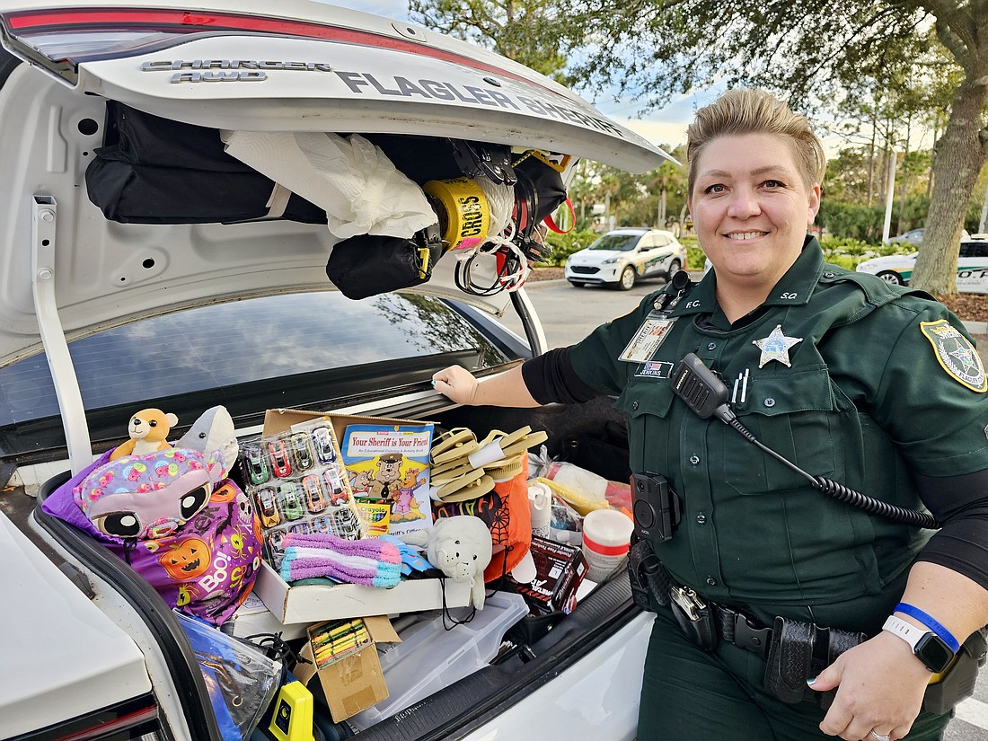 FCSO Deputy Laura Jenkins with her trunk full of goodies that she keeps on hand. Photo by Sierra Williams