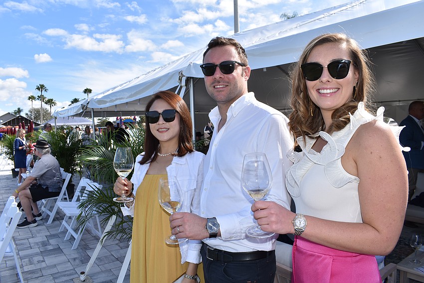 Lisa Ye and her husband Matthew Armstrong and Matthew's sister Lottie Armstrong enjoy champagne Dec. 31 at the new VIP Champagne Lounge hosted by A Vine Affair.