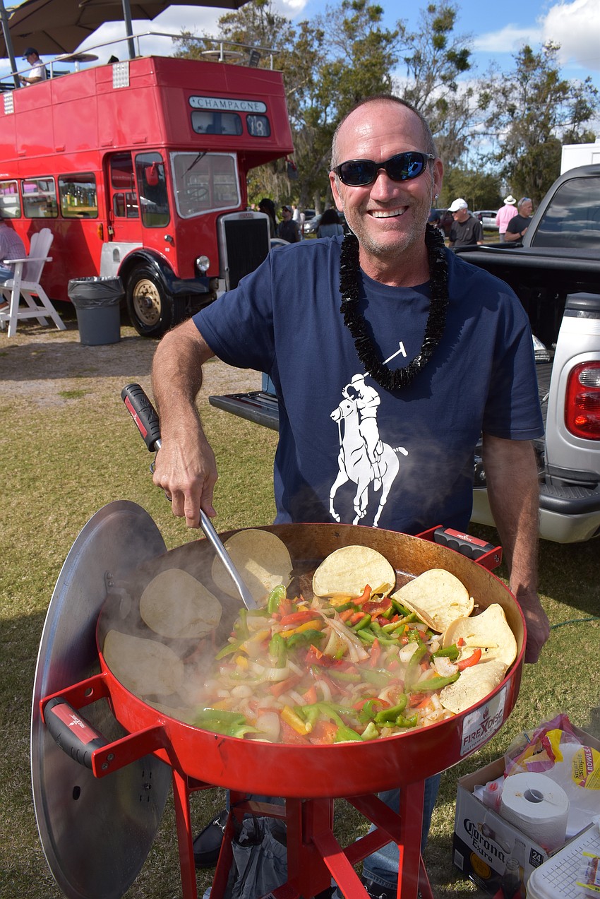 Port Charlotte's Jean Pierre Eischen cooks up shrimp and sausage fajitas for his tailgate party at the Sarasota Polo Club Dec. 31 in the season opener.