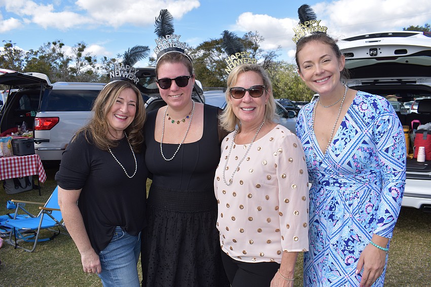 Sarasota's Ivone De Oliveira, Boston's Katie Hart, Sarasota's Cindy Flemion, and Sarasota's Melissa Puleo say they were looking forward to drinking champagne and divot stomping during the Sarasota Polo Club season opener.