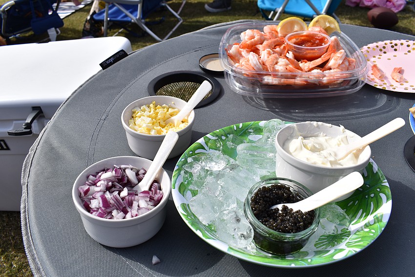 Some of the tailgate fans didn't go to the new VIP Champagne Lounge hosted by A Vine Affair to get their caviar at the Sarasota Polo Club' season opener. They brought their own for their tailgate party.