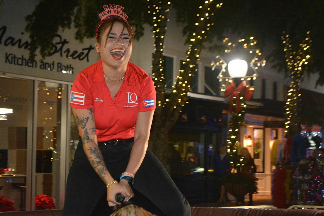 Daimy Sainz rides a mechanical bull.