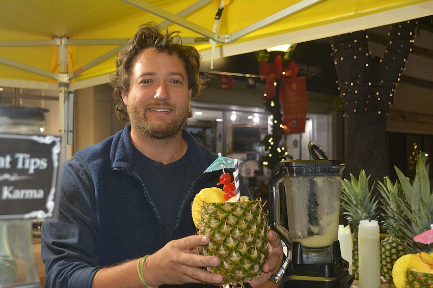 Jordan Johannes prepares a frozen pineapple drink.