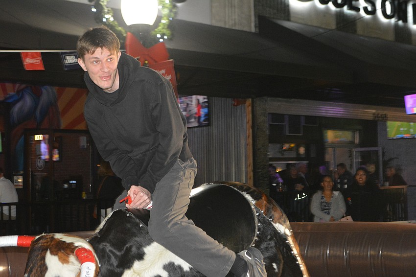 Ethan Swier of Sarasota takes a spin on the mechanical bull.