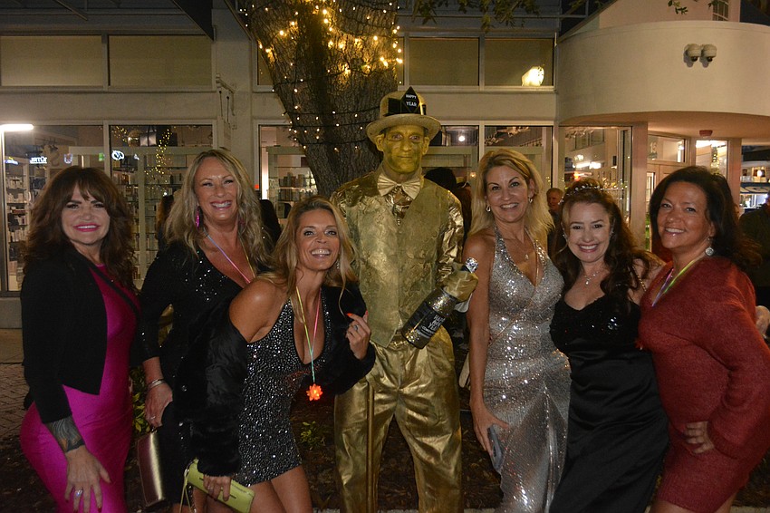 Jennifer Rogers, Diane Polen, Cheri Hathaway, Joe Abel, Tambria Lynn, Theresa Hendry and Emily Nikoloudis get in the NYE spirit.