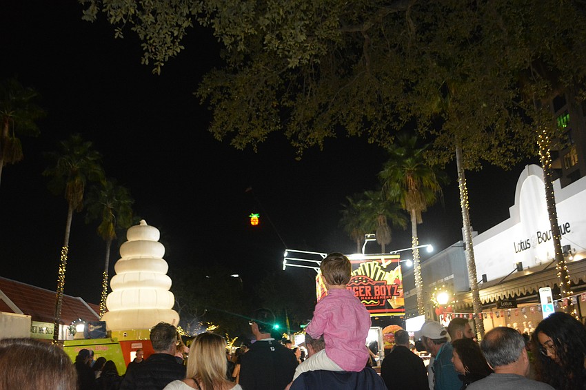The pineapple hangs above the crowd on New Year's Eve.