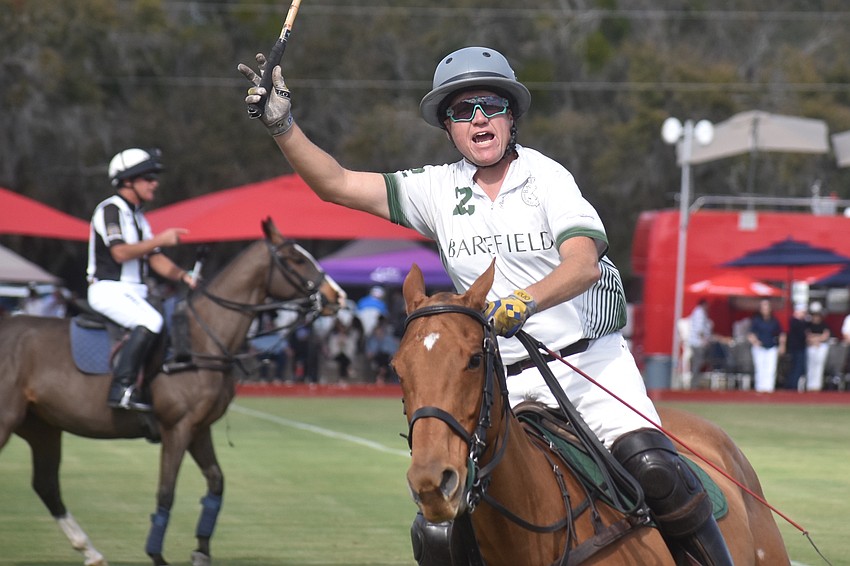 Barefield/Rawhide Creek's Mark Mulligan salutes the crowd before the start of the season opener Dec. 31 at the Sarasota Polo Club in Lakewood Ranch.