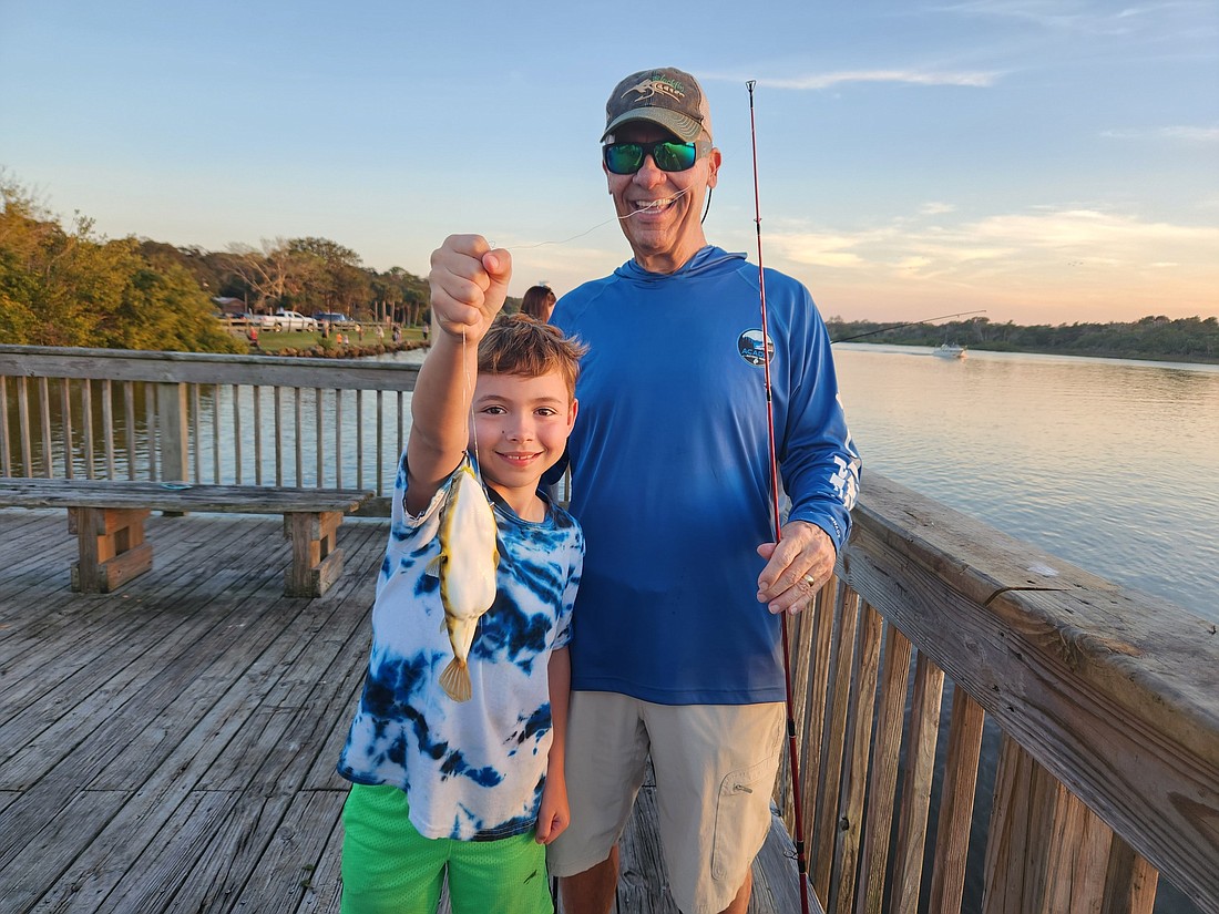 Through the Kids4reel program, Jeff Murphy teaches kids like Nathaniel Tallent, 9, how to fish. Photo courtesy of Jeff Murphy