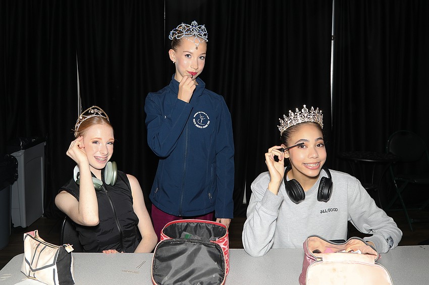 Ballerinas Macie Miersch, 14, Madelyn Murphy, 12, and Taylor André, 15, prepare for their performances.