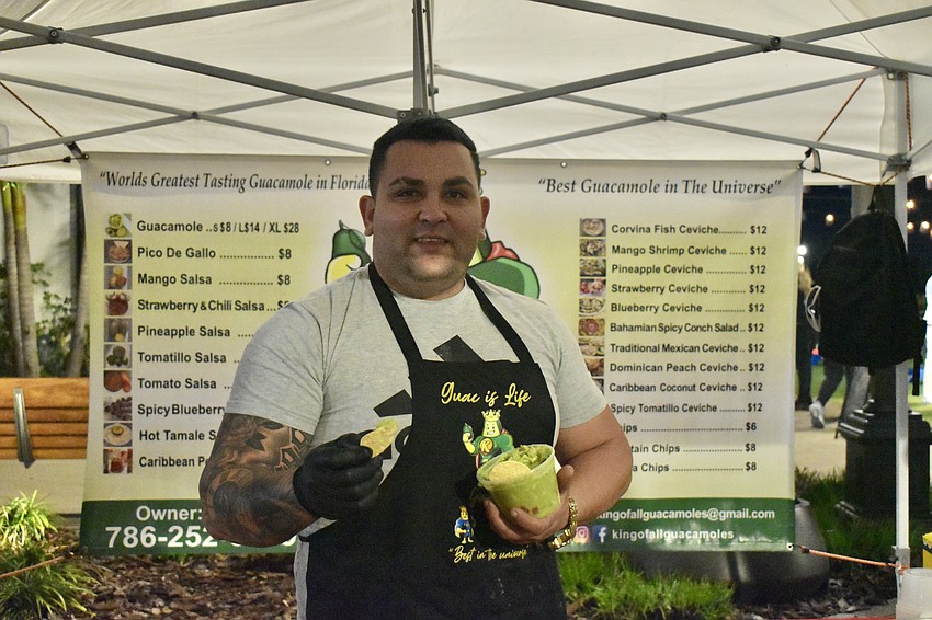 Anniel Gonzalez, owner of King of All Guacamoles, hands out samples of his guacamole and salsas.