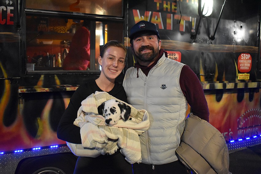 Kayla Morgan and Lance Morrison bring their 9-week-old puppy Layla to Ranch Nite Wednesday.