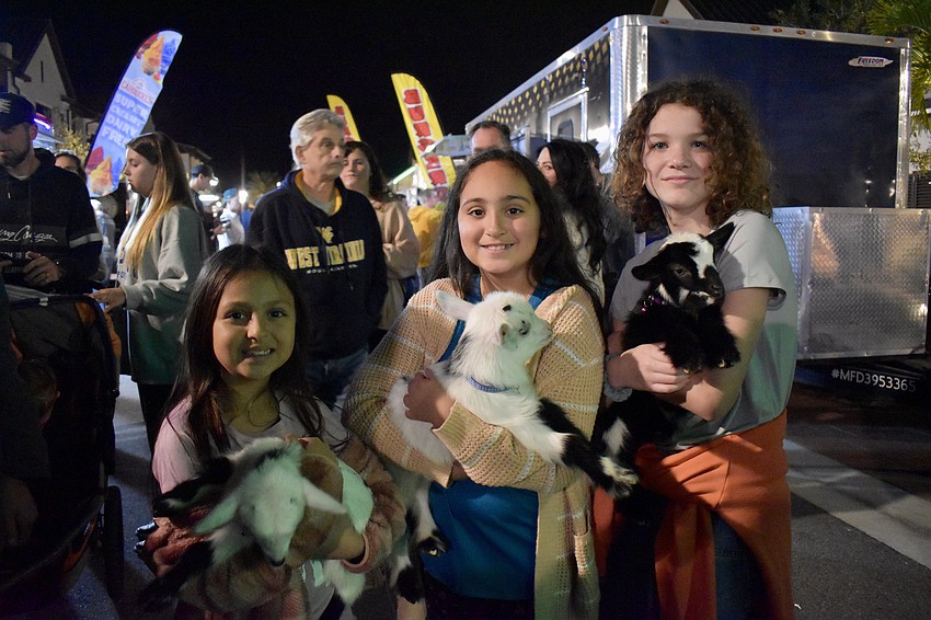 Chloe Quesada, Sofie Quesada and Addison Fierro bring 2-week-old goats to Ranch Nite Wednesday. They're yoga goats.