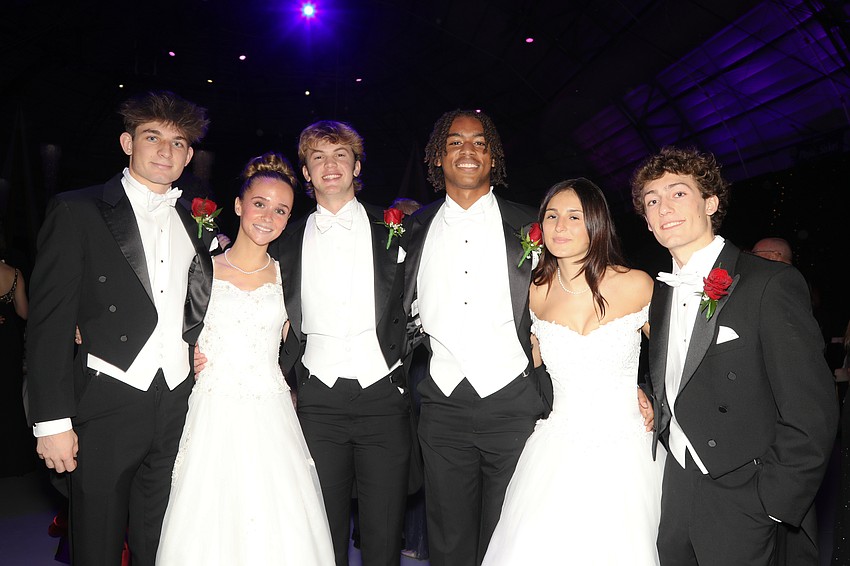 Debutante Alexandra Frank and her escorts, John Antonucci and Clayton Dees, and Debutante Carson Dye with her escorts, Nicholas Bryan and Robert Dennis.