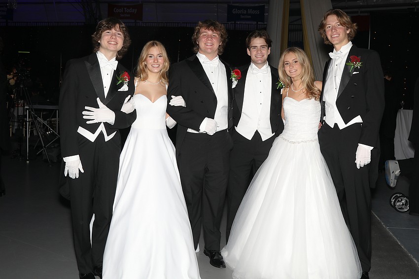 Debutante Violet Marx and her escorts, Luke Palmer and Jack Folvit, and Debutante Izzy McCloskey with her escorts, Sam Romine and James Rowan.