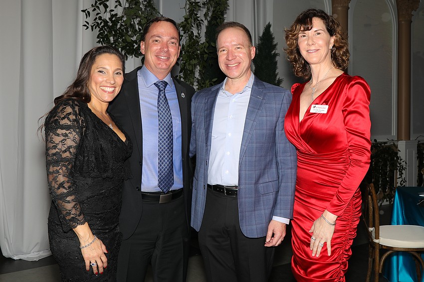 Eric and Tommy Gregory with Greg and Jen Douglas