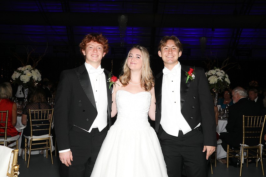 Debutante Reese Nippert and her escorts, Trey Raymond and Lincoln States.