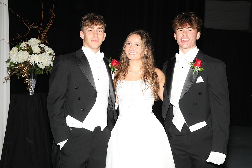 Debutante Marissa Saba and her escorts, Luca Ripo and Oliver Murray.