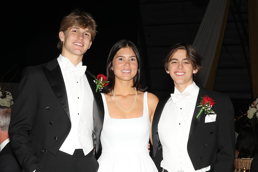 Debutante Olivia Seidensticker and her escorts, William McKinzie and Rhett Morton.