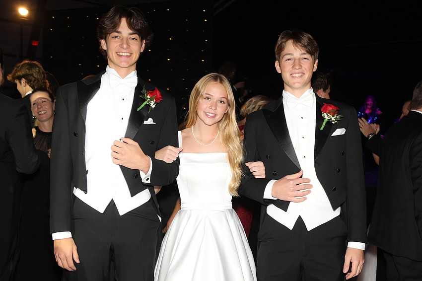 Debutante Carmella Swencki and her escorts, Jackson King and Charlie Peggs.